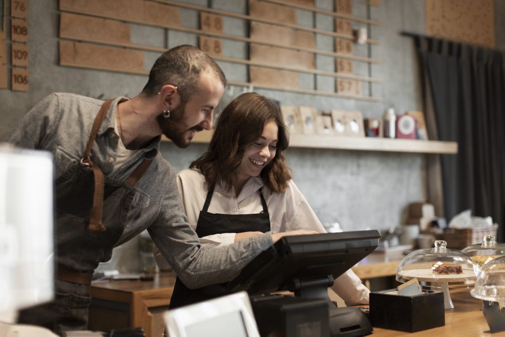 Employees using a POS hardware