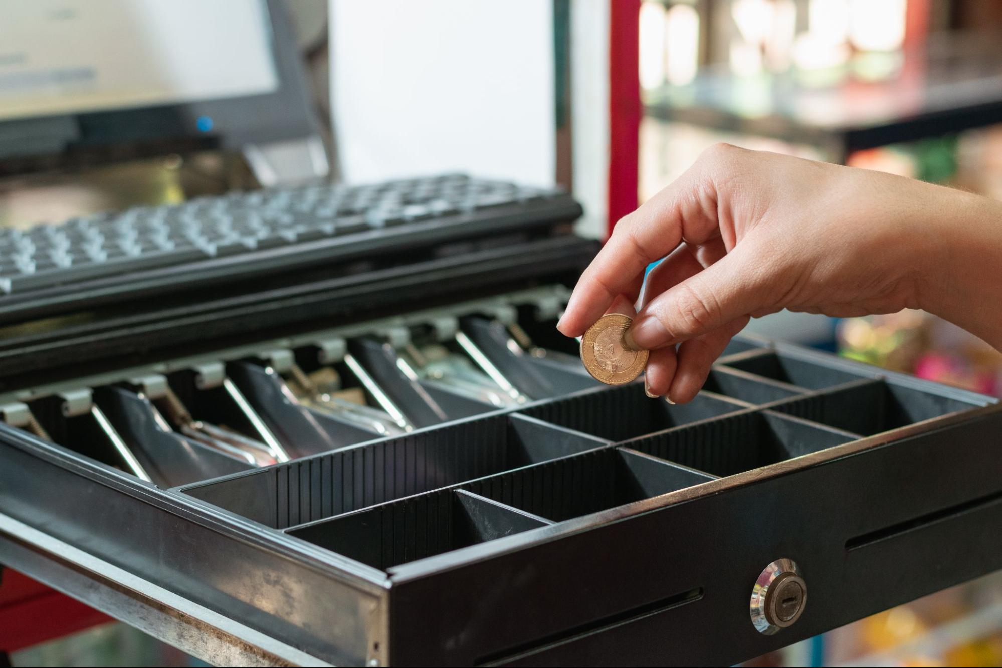 Woman Taking Money From Cash Register | Condor POS